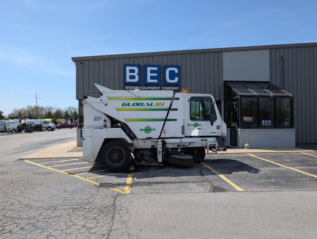 Global M3 street sweeper parked outside Brown Equipment Company.