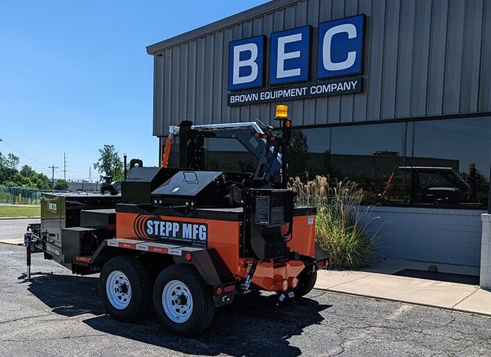 Stepp 275-gallon crack sealer trailer parked outside Brown Equipment Company.