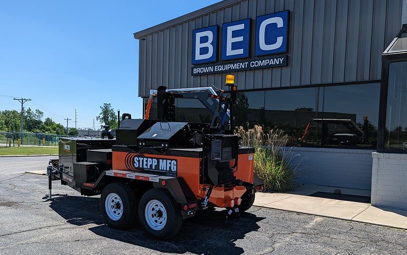 Stepp 275-gallon crack sealer trailer parked outside Brown Equipment Company.