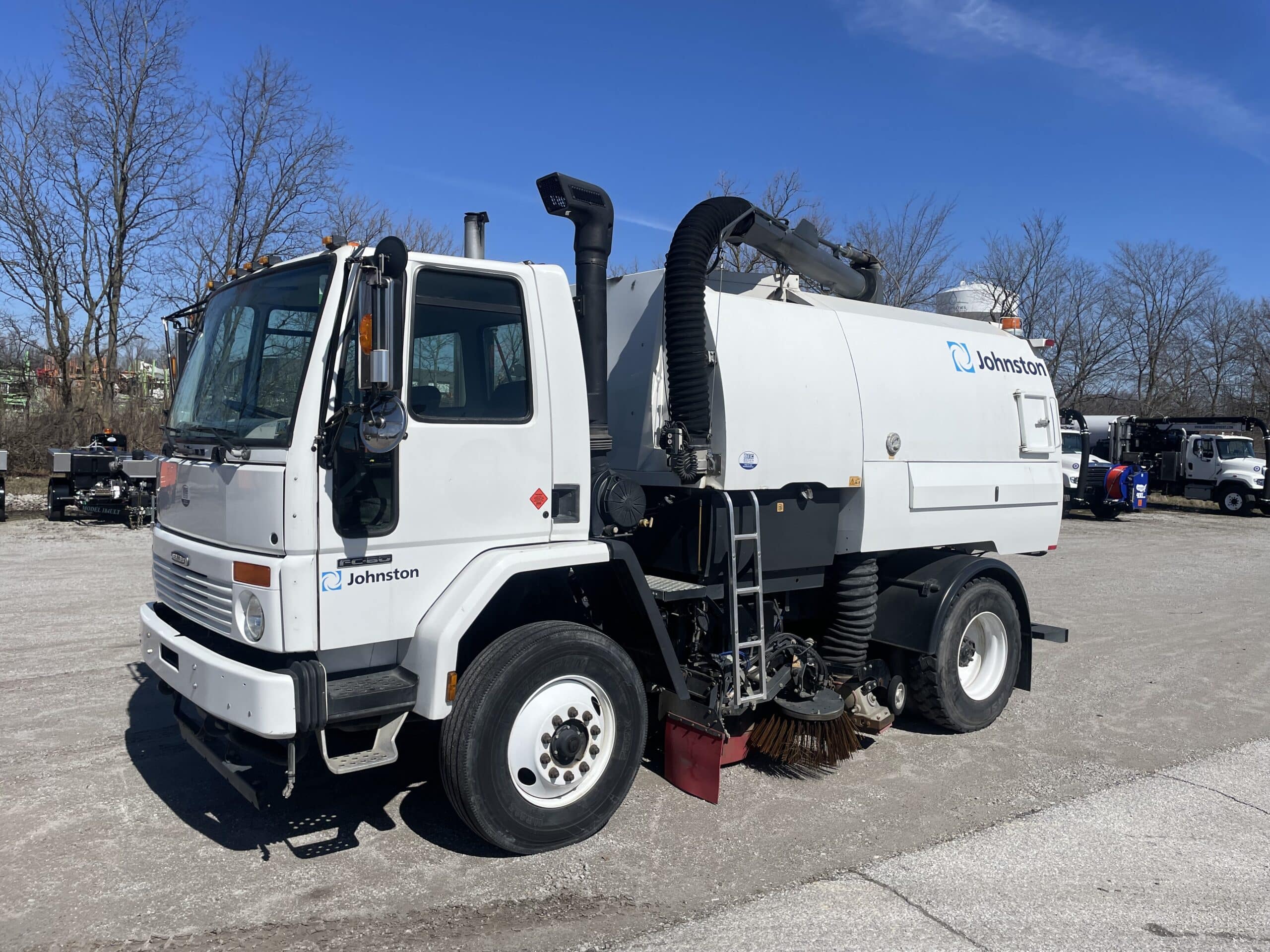 Johnston VT650 street sweeper on Freightliner FC-80, ideal for efficient road cleaning.