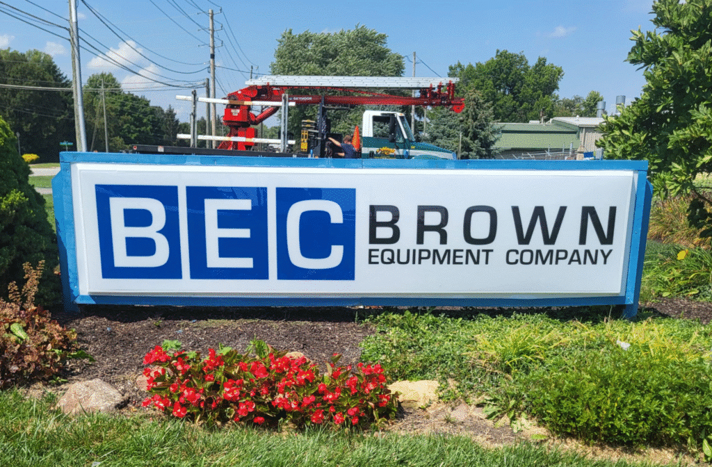 BEC Brown Equipment Company signage with landscaping and equipment in the background.
