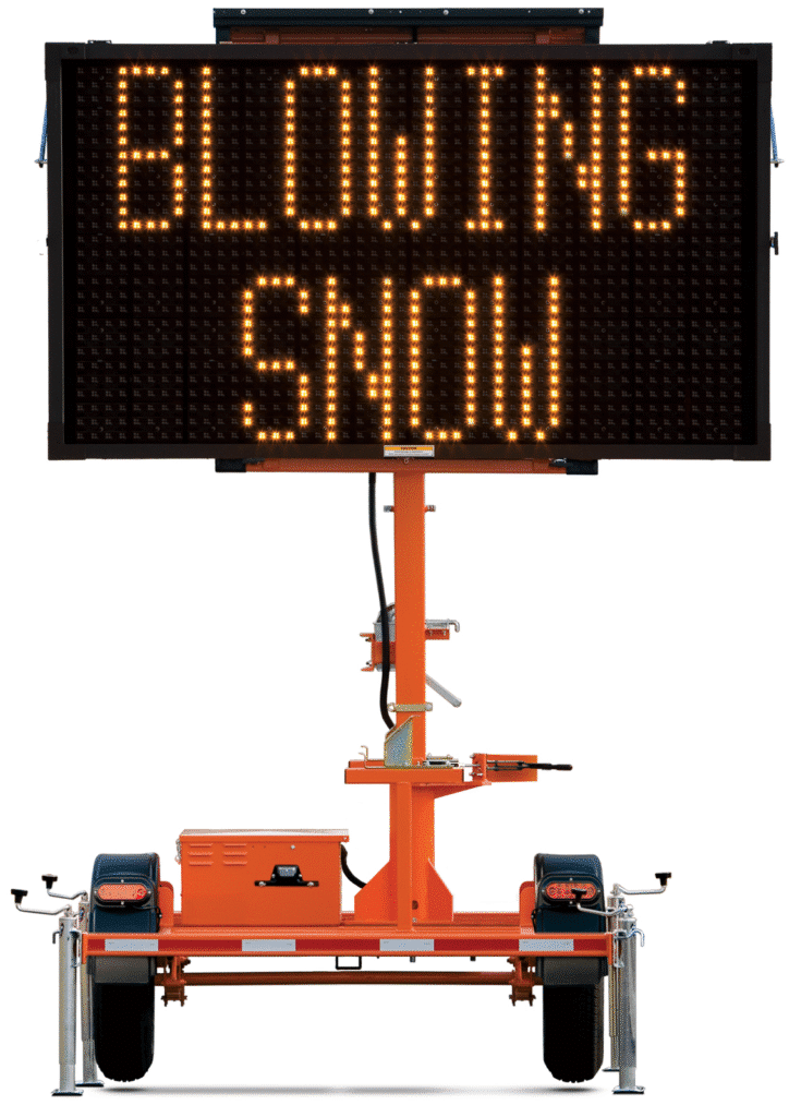 Blowing snow hazard warning sign for safe travel conditions.