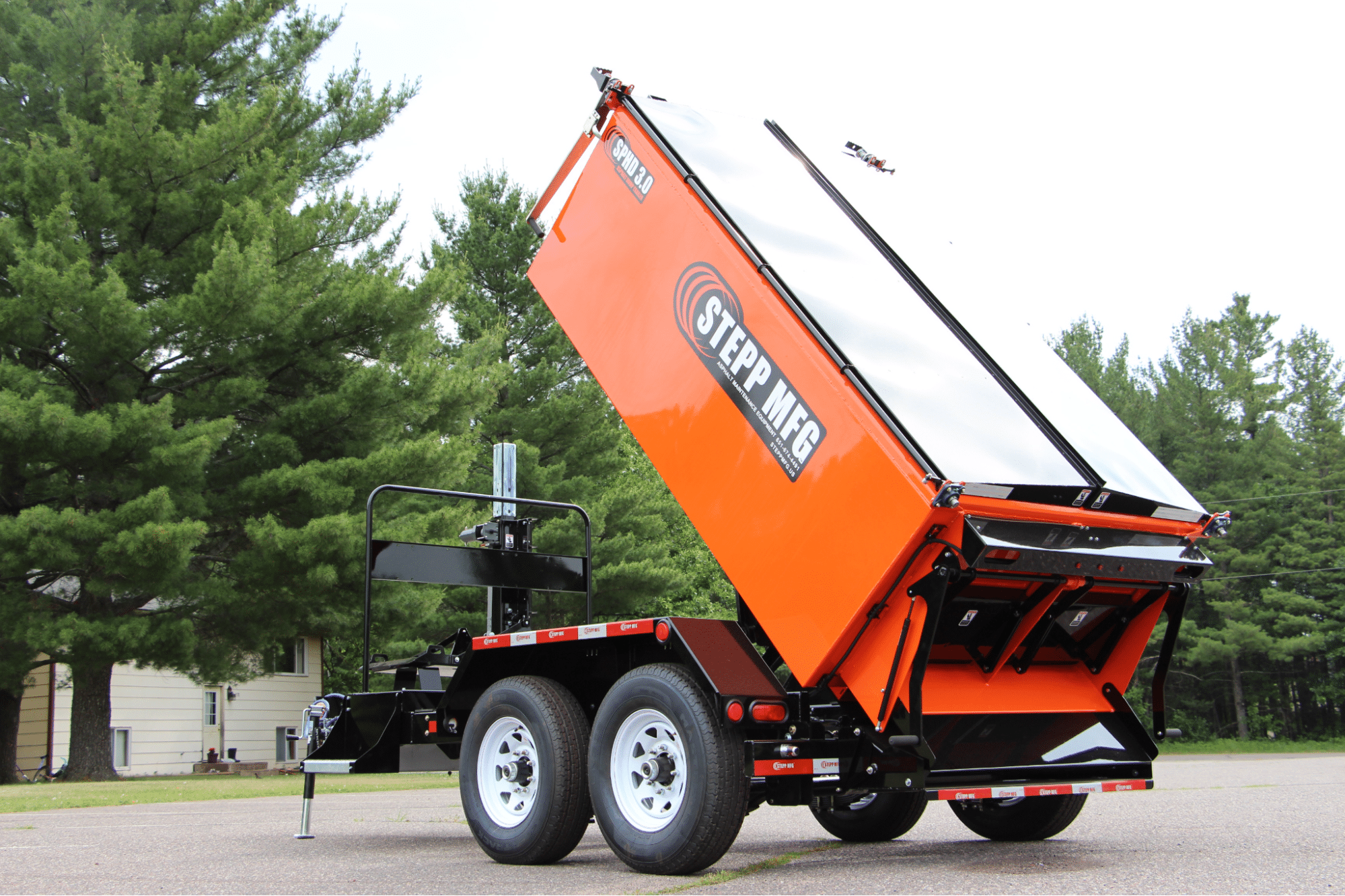 Heavy-duty dump trailer lifting for efficient material transport and hauling.