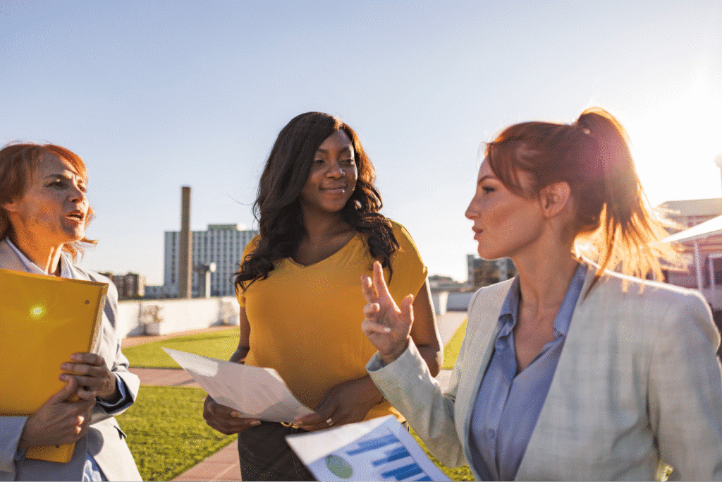 Women engaging in fleet management discussion.