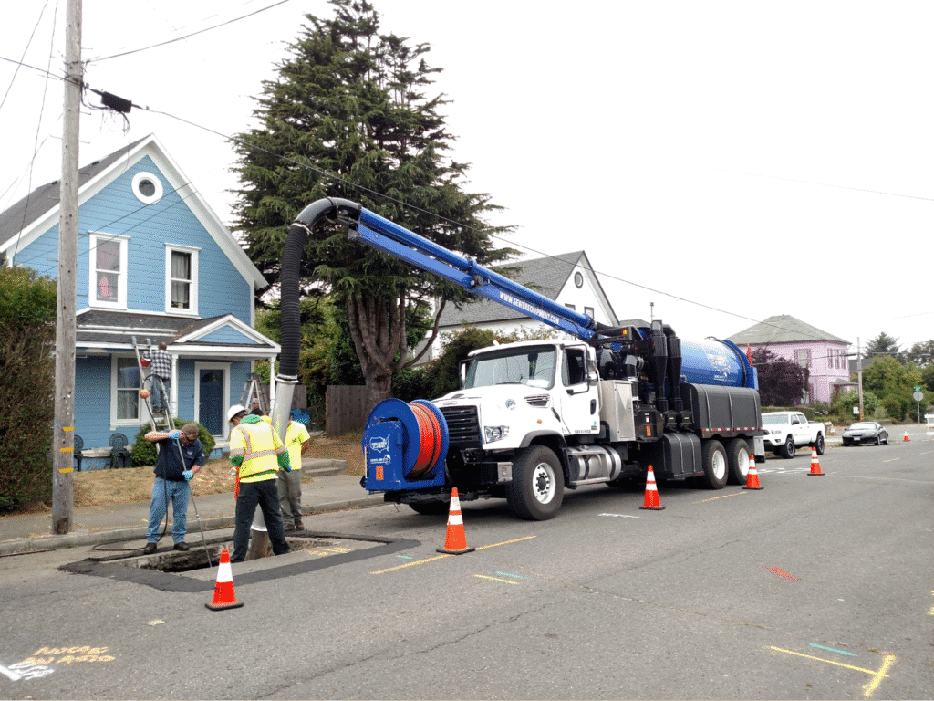Hydro excavation with crew and equipment.