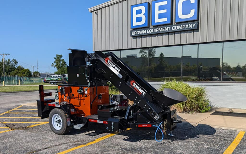 Asphalt patcher outside BEC Company building.