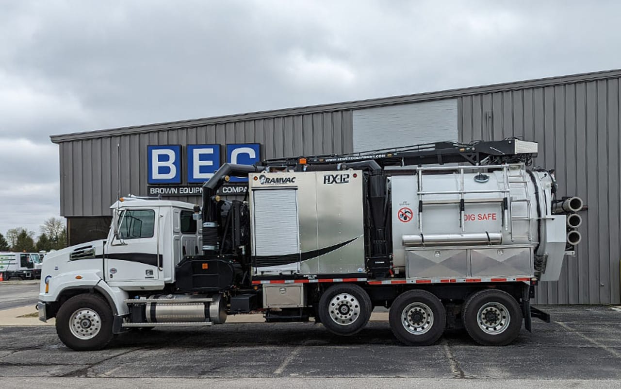 RamiVac HX12 vacuum truck parked outside an equipment company for industrial use.