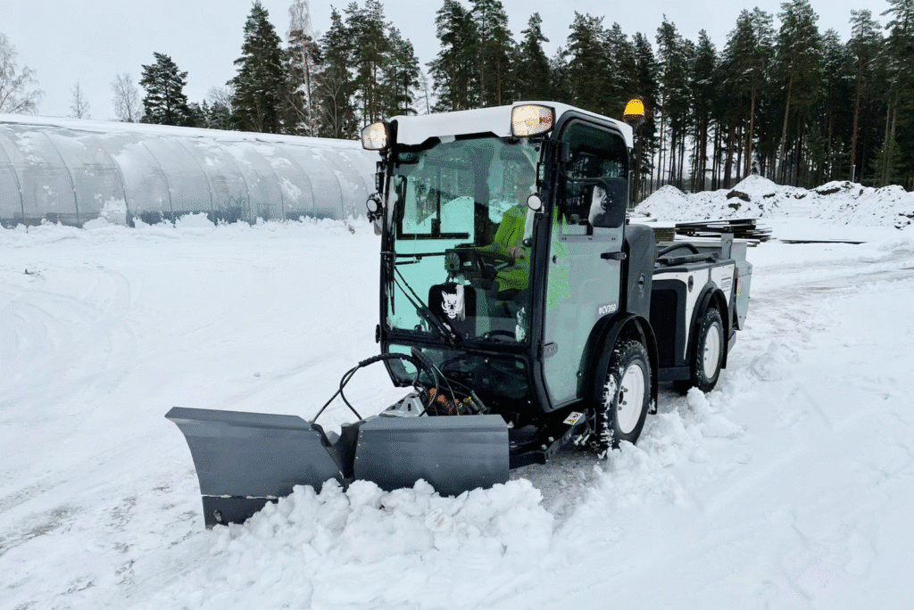 Snow plow efficiently clearing snowy roads in winter.