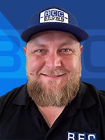 Trevor Rapp smiling, showcasing dedication and positive service in the workplace.