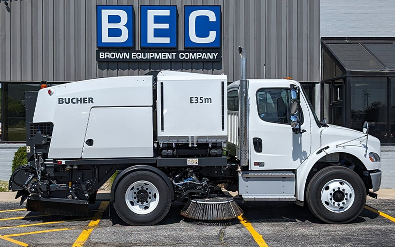 Bucher E35m sweeper truck parked at Brown Equipment Company, showcasing efficient street cleaning capabilities.