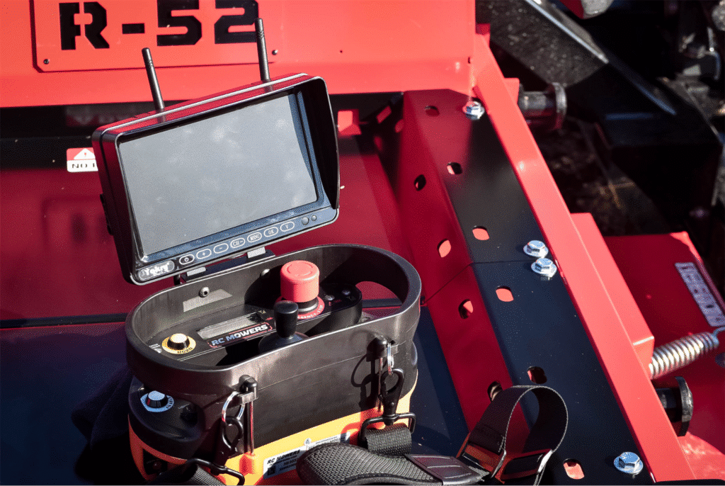 Robotic mower control panel with display and controls for automated lawn care.