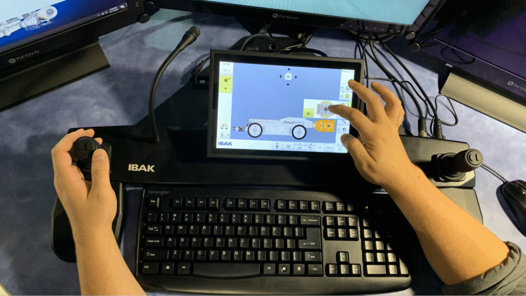 User interacting with touchscreen controls for pipeline camera inspection technology