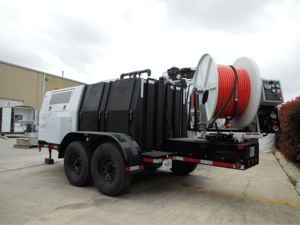 Industrial jetter trailer with hose reel for efficient water management and drainage solutions.