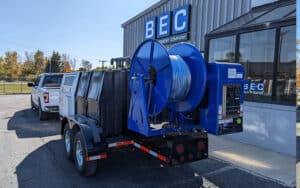 Mongoose Jetter on trailer, ideal for drain cleaning and maintenance services.