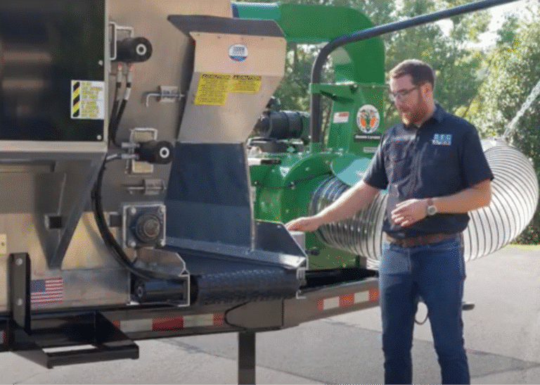 Man demonstrating a commercial landscaping machines features and function outdoors.