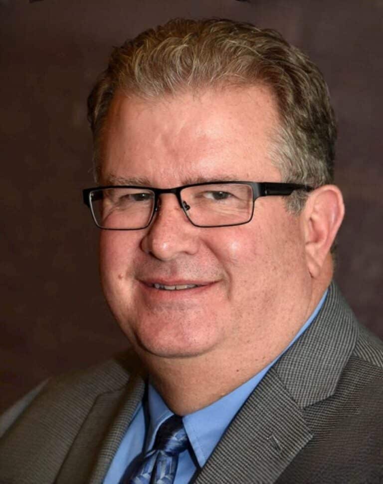 Gary Lindesmith portrait showcasing confidence and professionalism in a business setting.