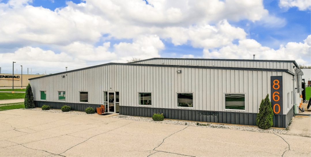 BEC Wisconsin Service Center building exterior at 860, featuring modern design and ample parking space.