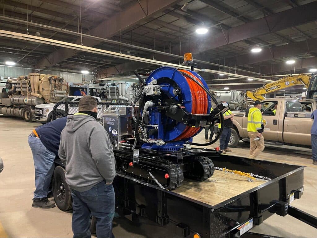 Powerful Sewer easement machine displayed in a warehouse for maintenance and repair services.