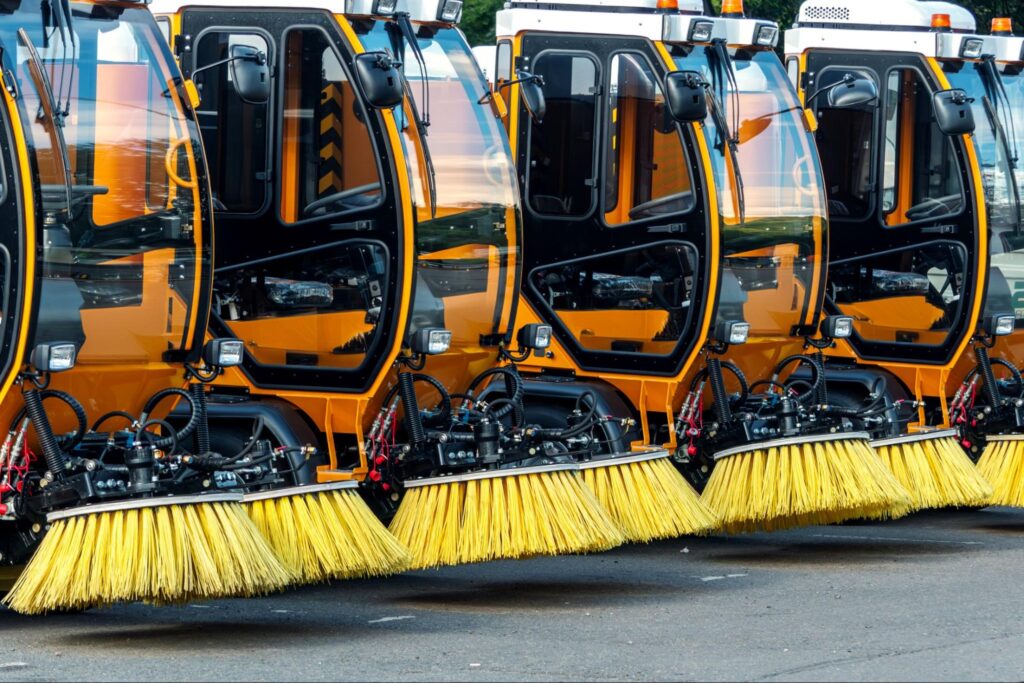 Street cleaning machines ready for efficient urban maintenance and debris removal.