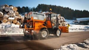 Multihog vehicle efficiently clears snow on a winter road.
