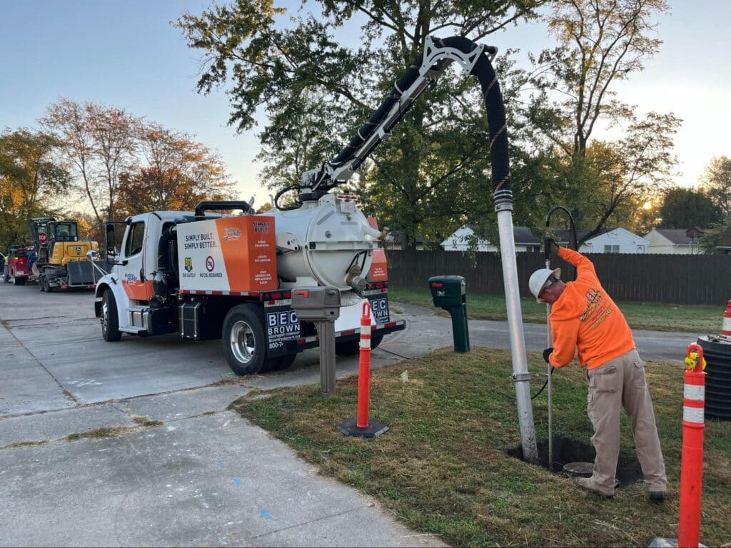 Worker operating a vacuum truck for efficient site excavation and cleanup.