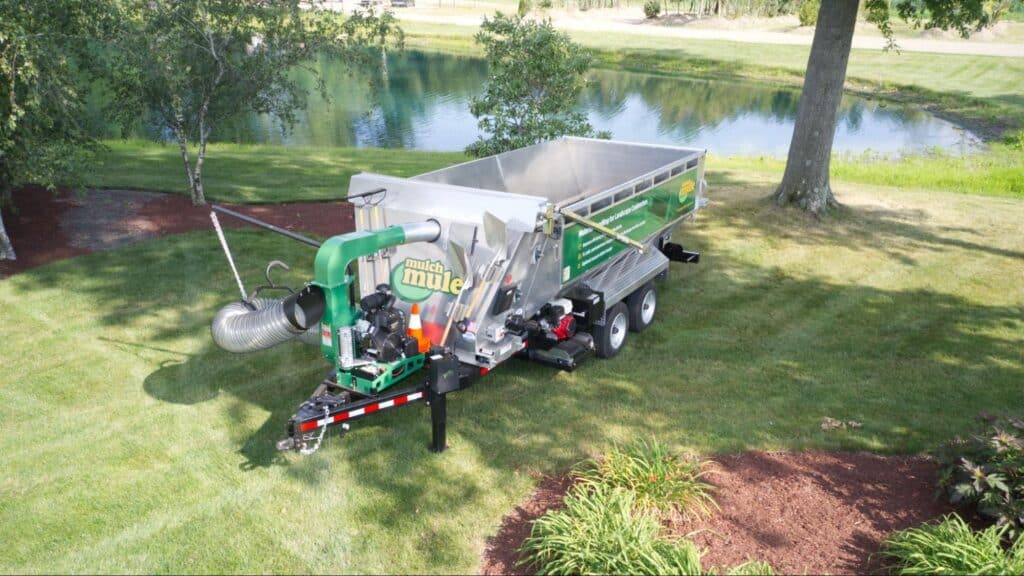 Mulch Mule trailer parked by a peaceful pond.