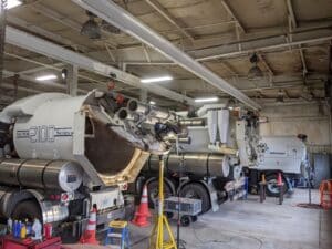 Advanced heavy machinery showcased in a service center workshop.