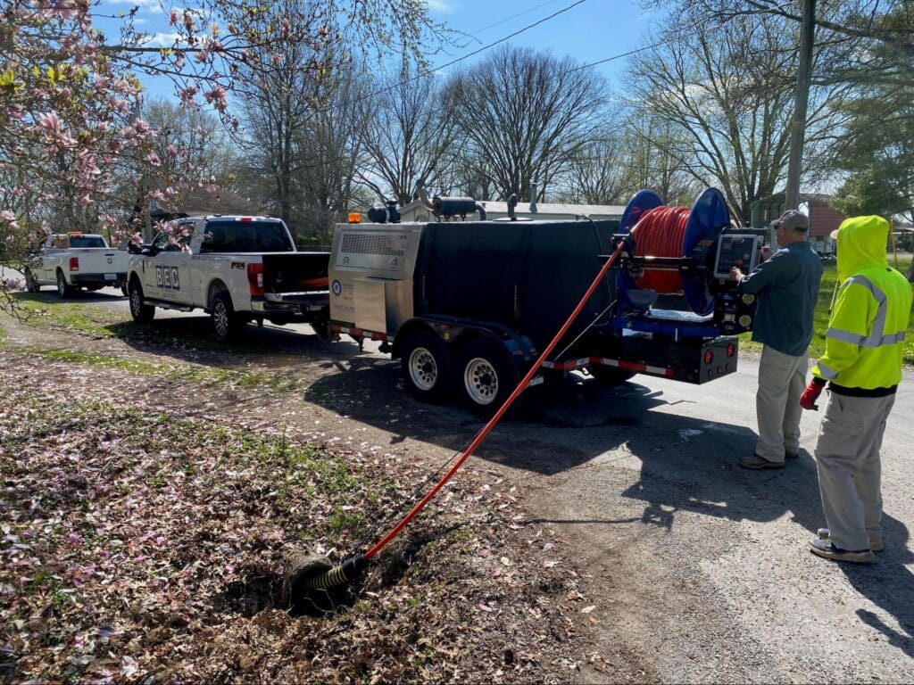 Local road maintenance crew using a Mongoose Jetter for excavation work.