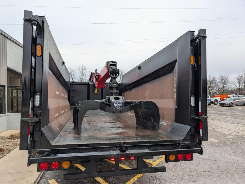Heavy-duty grapple truck equipped for efficient material handling and heavy lifting tasks.