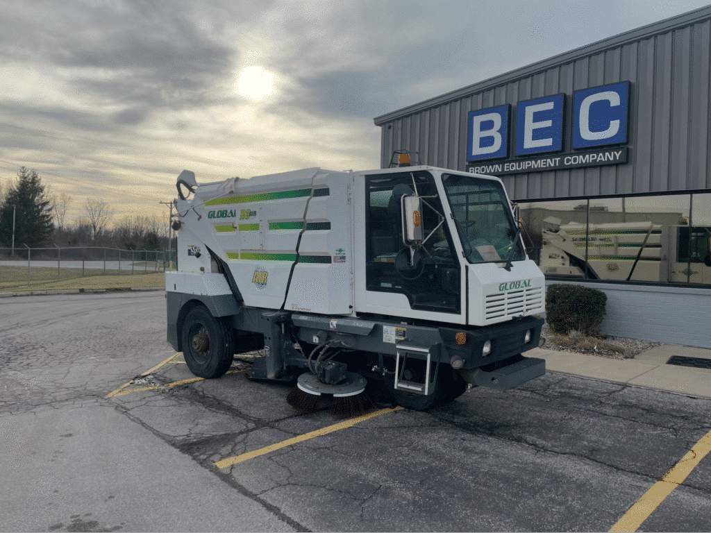 Street sweeper parked at BEC Equipment, showcasing urban cleaning technology.