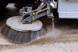 Street sweeper effectively removing dirt and debris from pavement.